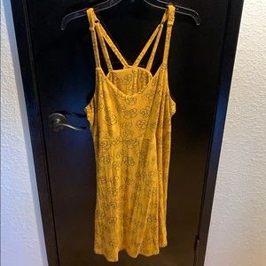 Mustard yellow dress with flowers.